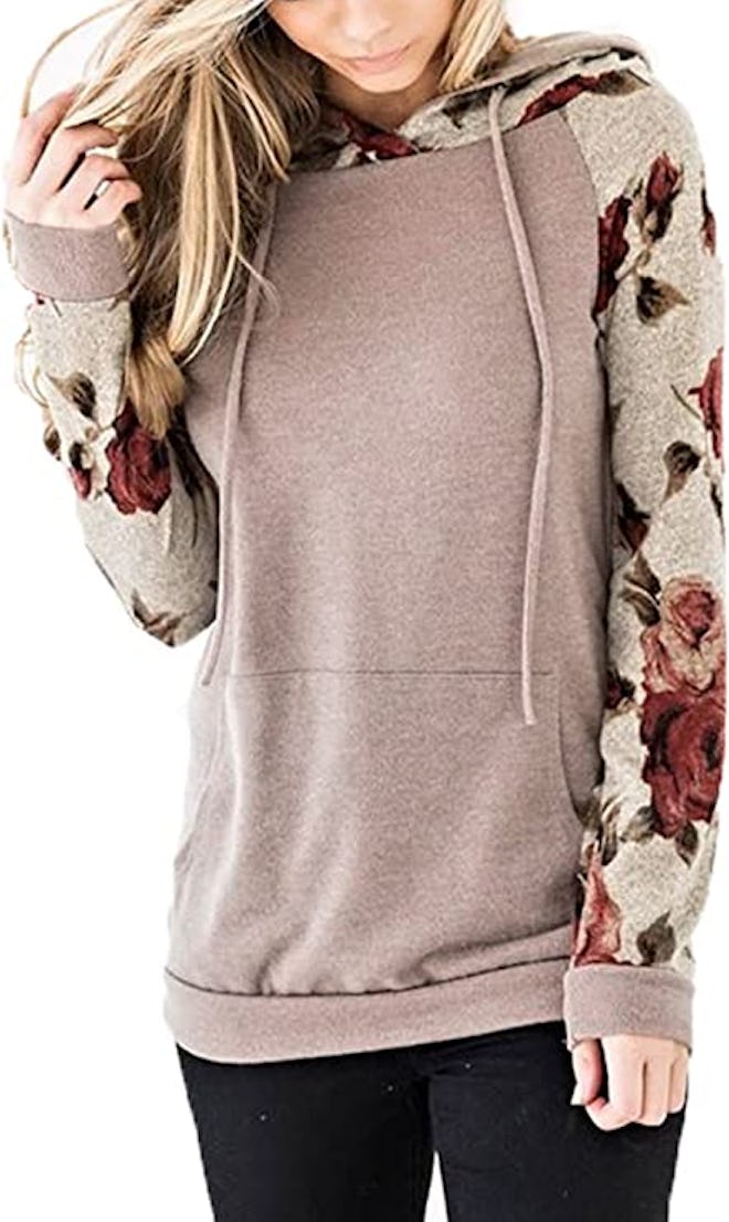 Dress up a casual look with this soft sweatshirt featuring cute floral sleeves.