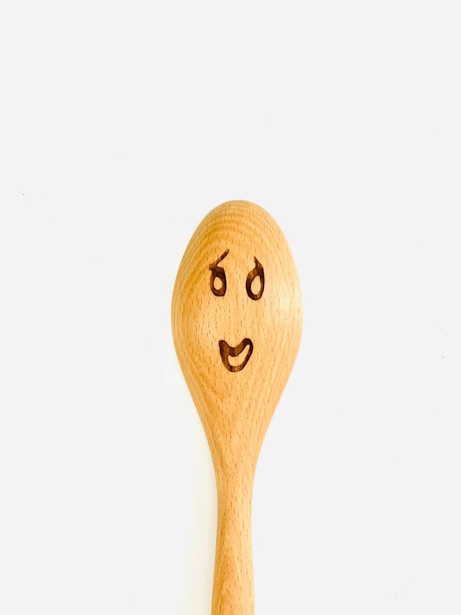 A great Great British Bake Off gift would be this wooden spoon engraved with a smiling face just lik...