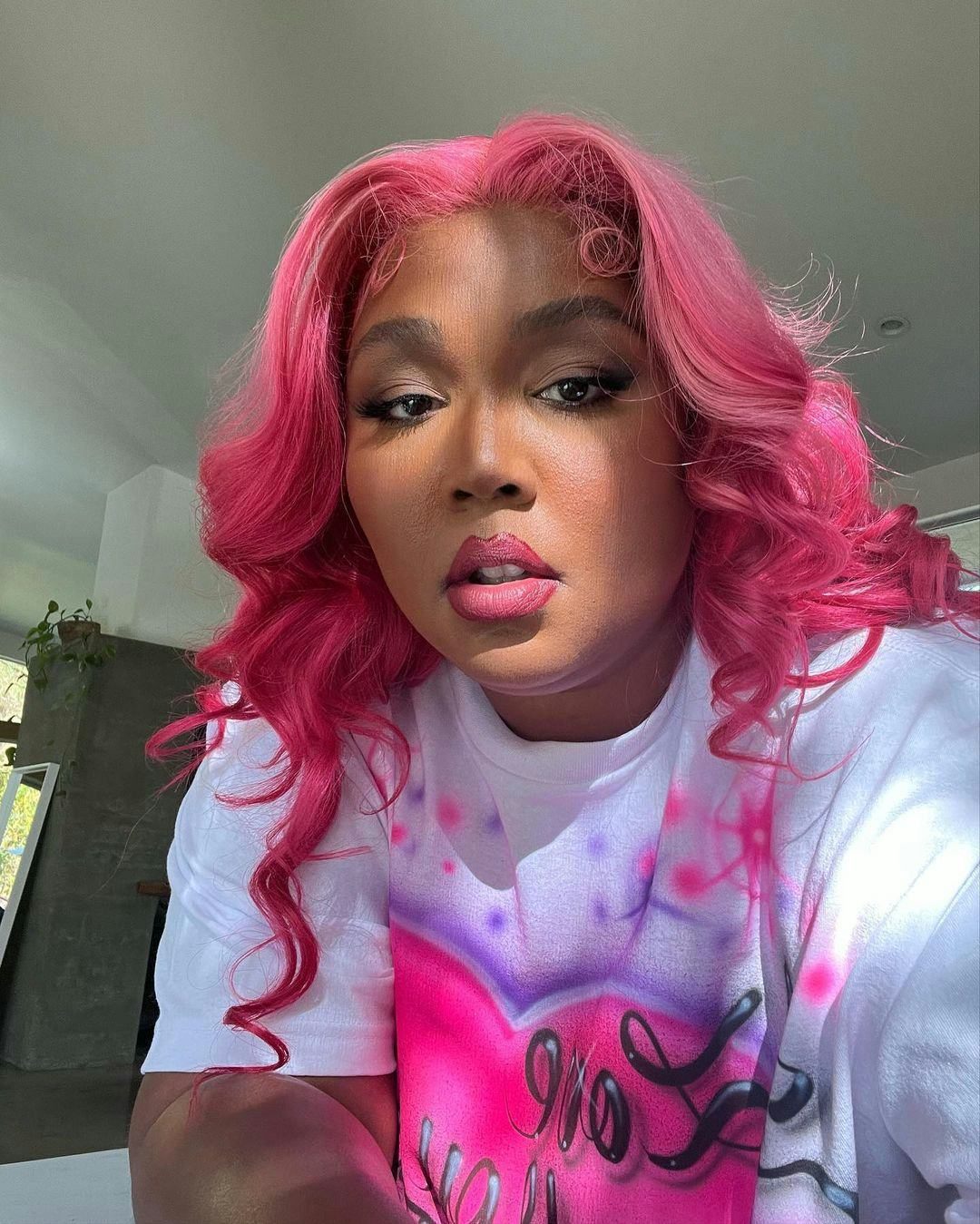 Lizzo with Barbiecore pink hair.