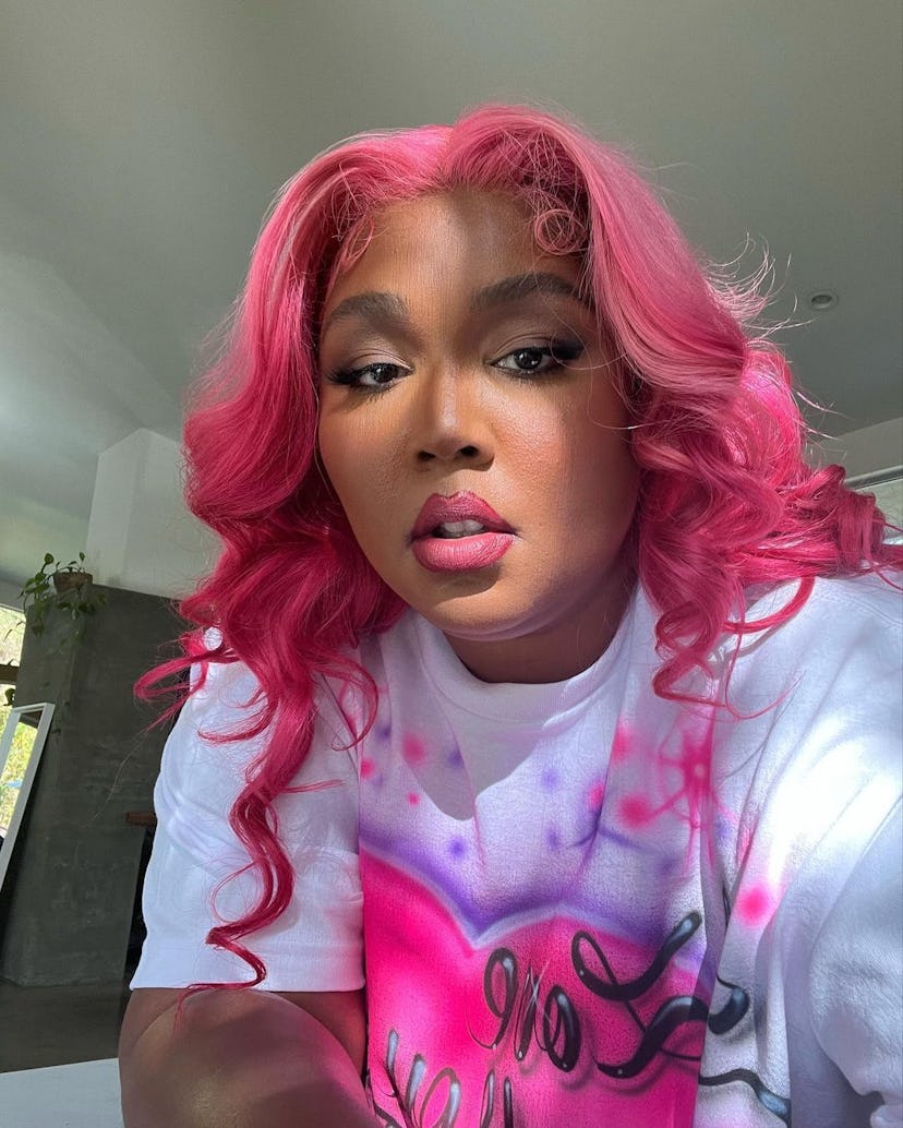 Lizzo with Barbiecore pink hair. 