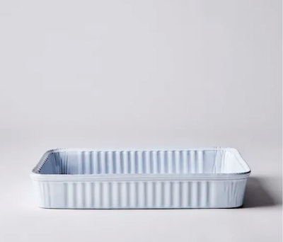 A ceramic baking dish that looks like a disposable tin one, a funny idea for a Great British Bake Of...