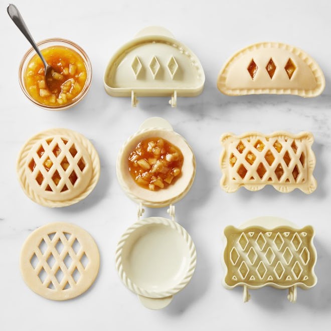 Mini pie molds with hand pies and fruit filling inside