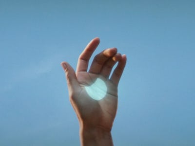 A solar eclipse projected on someone's hand.