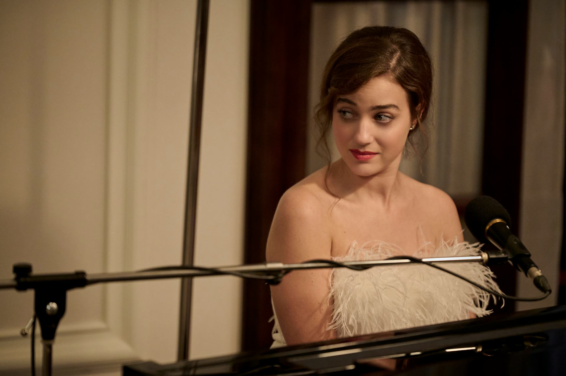 Beatrice Grannò wears a white dress with feathers as Mia in &lsquo;The White Lotus&rsquo; Season 2 Episode 6.