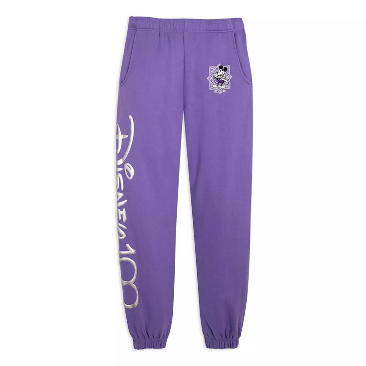 The Disney 100th anniversary has new Disney merchandise like these purple sweatpants.  