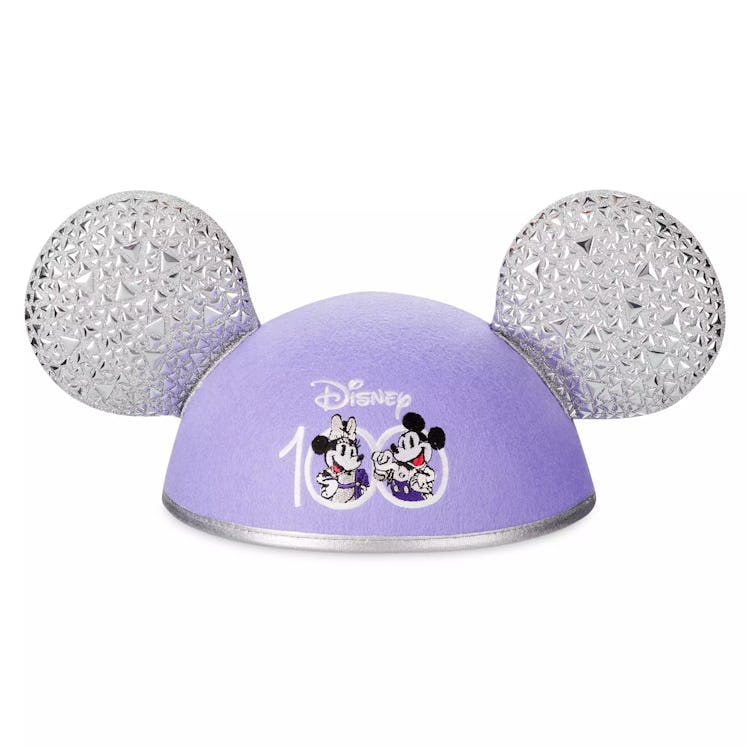 The Disney 100 ear hat has Mickey Mouse and Minnie Mouse on the front. 