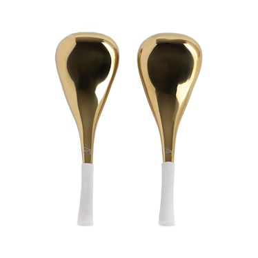 two golden face sculpting tools