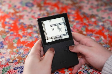 The Analogue Pocket playing a Gameboy cartridge.