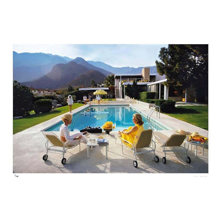 a slim aarons photograph of a couple by a pool in los angeles