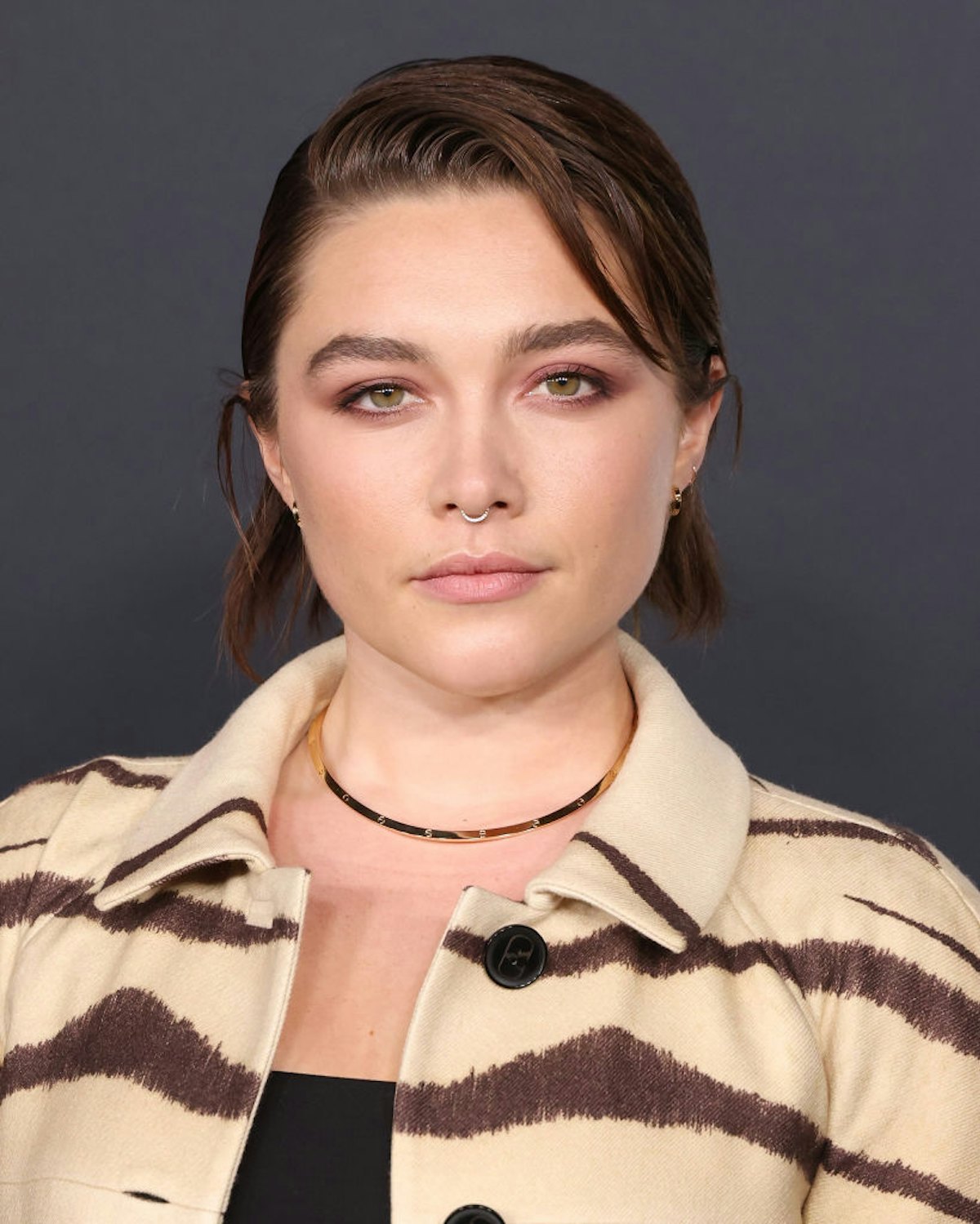 Florence Pugh debuted a dark brunette hair color and a shaggy "mixie" haircut in 2022.