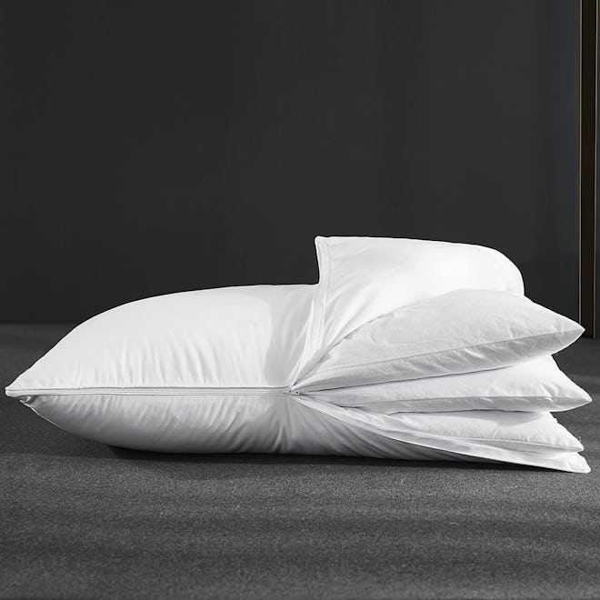 This feather pillow for arm sleepers features three layers that can be removed for height customizat…