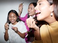 Young friends applying TikTok's favorite lipsticks.