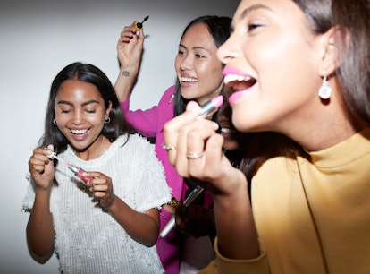 Young friends applying TikTok's favorite lipsticks.