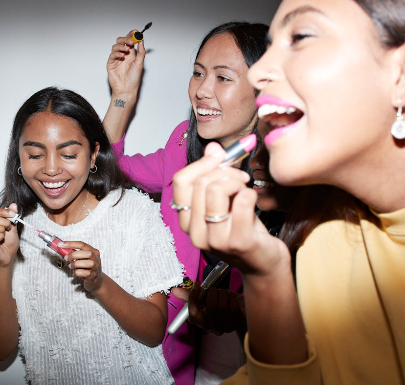 Young friends applying TikTok's favorite lipsticks.
