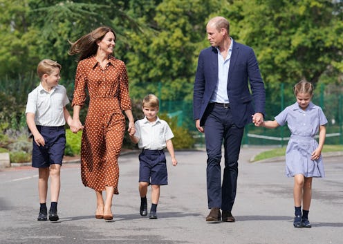 Prince George, Princess Charlotte and Prince Louis (C), accompanied by their parents the Prince Will...