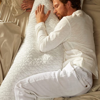 This full body pillow for arm sleepers also provides support to your legs.