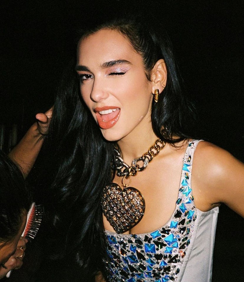 Dua Lipa shimmery sparkly eye makeup and long waves