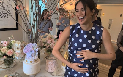 Meghan Markle laughing at her baby shower.