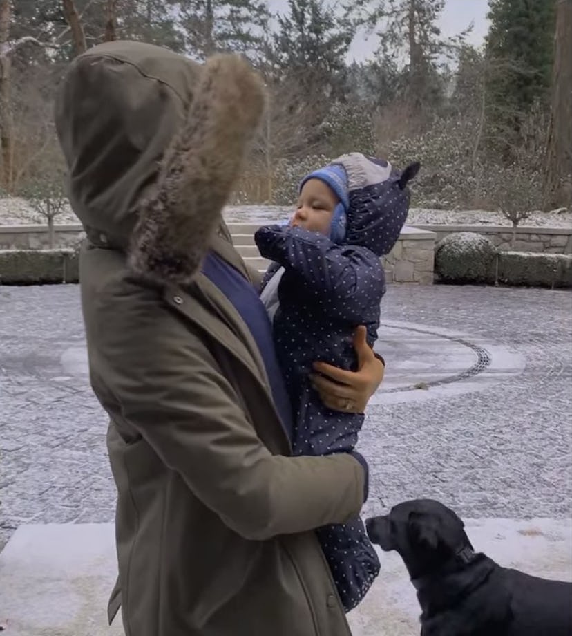 Meghan holds Archie, both bundled in winter gear.