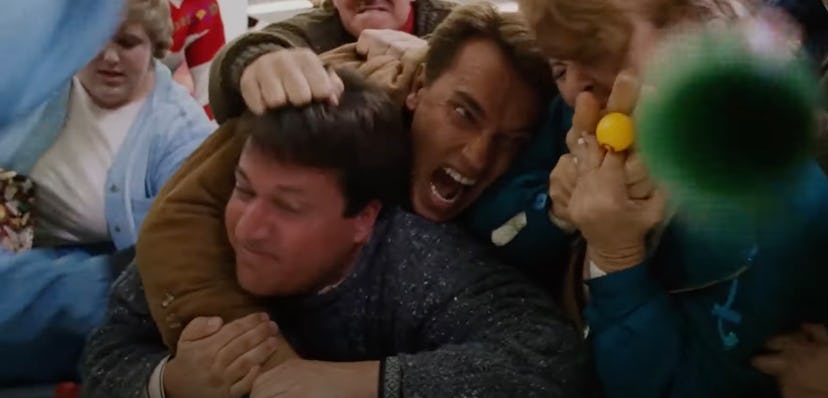 Howard (Arnold Schwarzenegger) and Myron (Sinbad) fight over the Turbo Man doll in 'Jingle All The W...