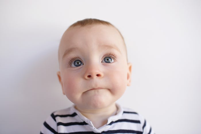 Closeup of baby with blue eyes in a story about the traits of a Capricorn baby