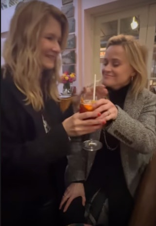 Reese Witherspoon and Laura Dern enjoy a Christmas cocktail.