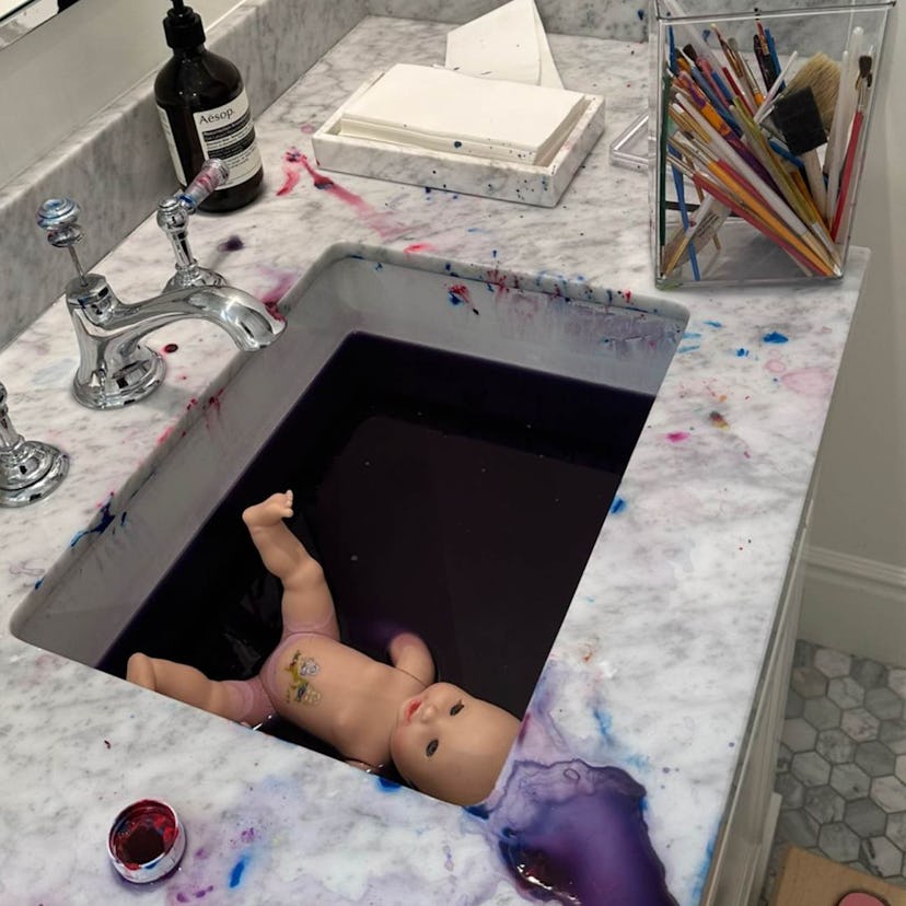 Stormi Webster painted mom Kylie Jenner's marble bathroom purple. Photo courtesy of Instagram/Kylie ...