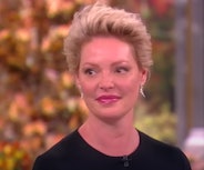 Katherine Heigl tears up when discussing her daughter's adoption and new motherhood.