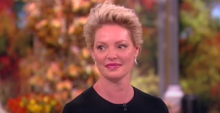 Katherine Heigl tears up when discussing her daughter's adoption and new motherhood.