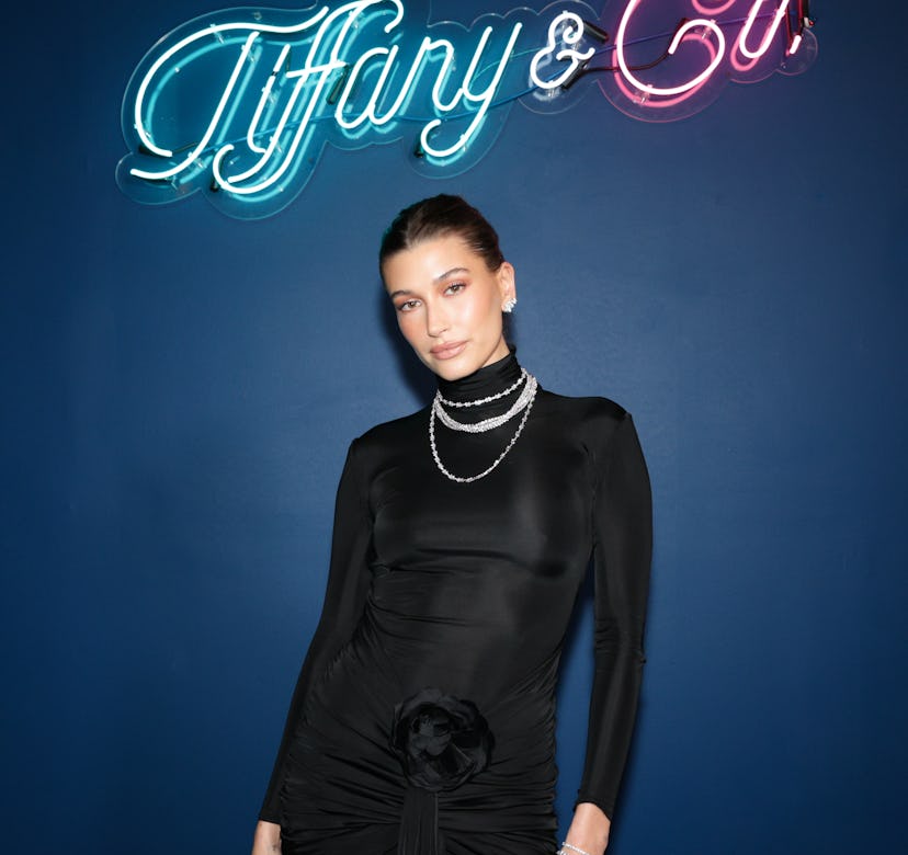 Hailey Bieber wearing a black mini dress from Saint Laurent at the Miami Art Basel 2022.