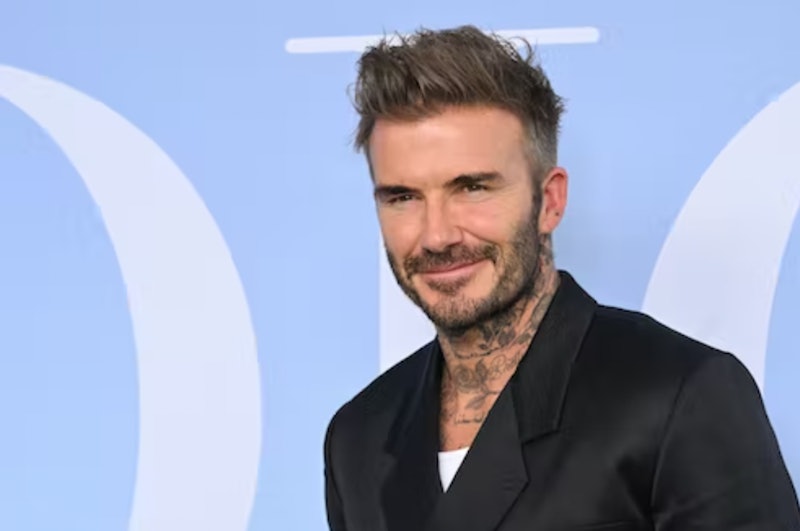 David Beckham wearing a black blazer and white shirt