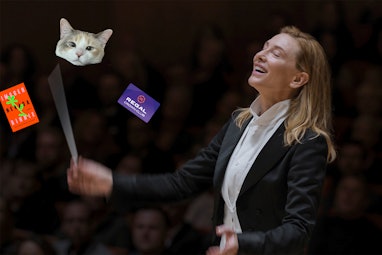 Lydia Tár conducting a book, a cat, and a Regal unlimited card.