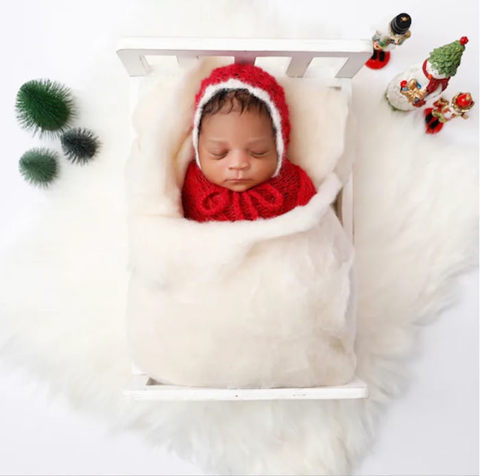 baby sleeping for a Christmas baby announcement