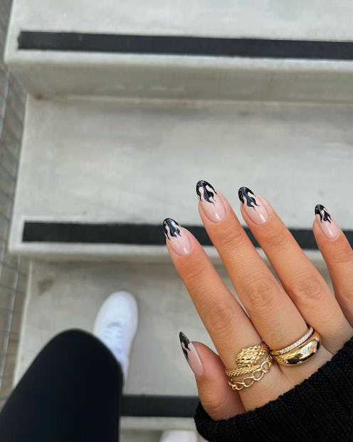 Here are black nail ideas — because black manicures & dark nail art designs never go out of style. F...