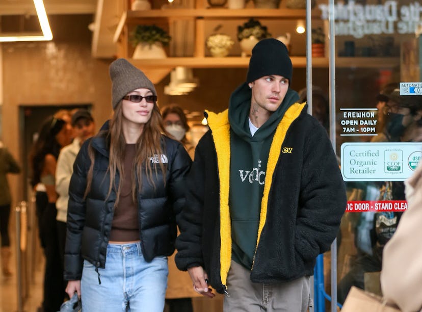 Justin and Hailey Bieber, wearing a cropped puffer jacket.