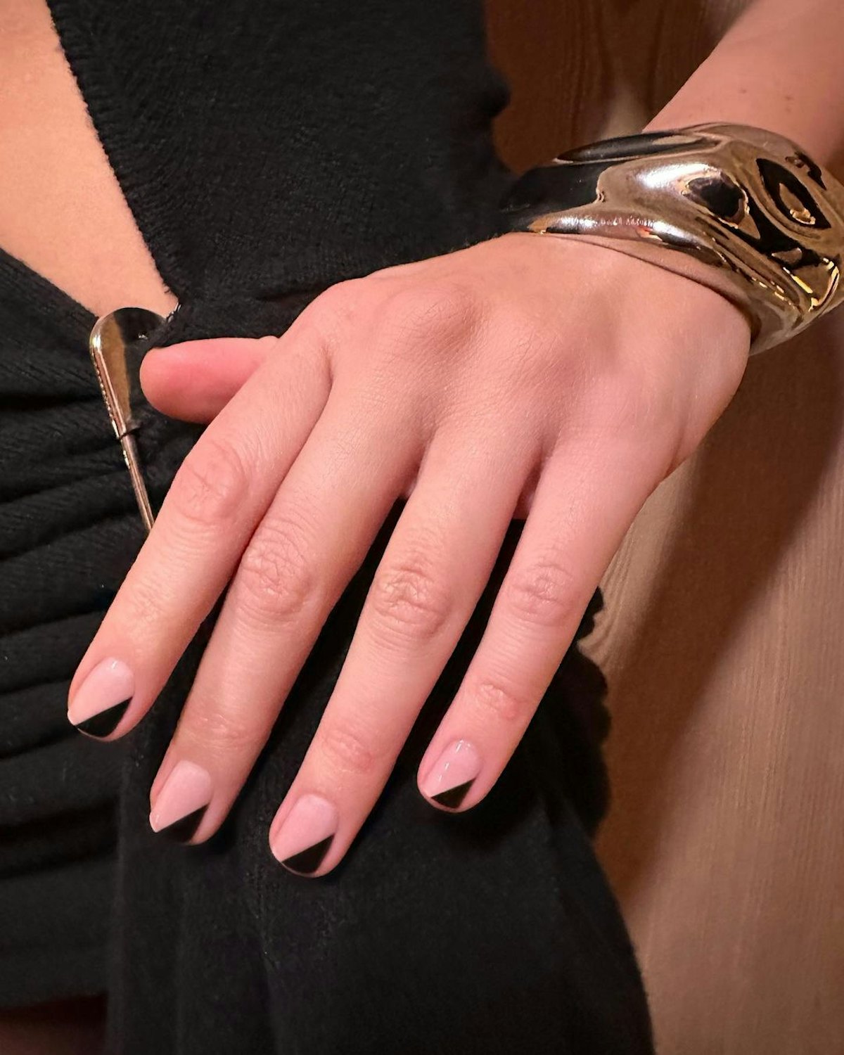 Try abstract black French tips on your nails for Capricorn season.