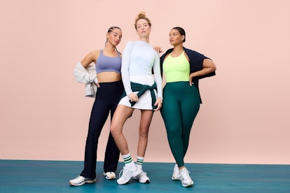Three confident women modeling activewear