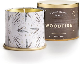This soy candle comes in a small, decorative tin and features notes of cedarwood and smoke.