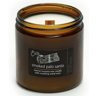 This candle is made with eco-friendly coconut wax, sustainable plants and herbs, and smells of smoke...