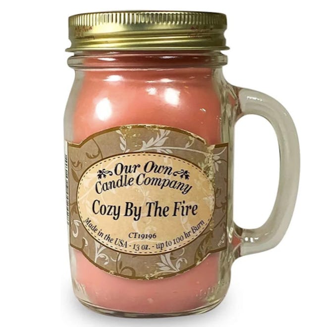 This soy and paraffin candle brings cozy fireplace vibes in a reusable mason jar with handle.
