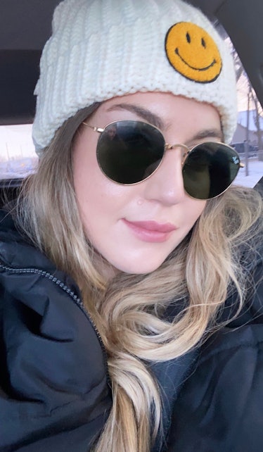 Woman in sunglasses and knit cap