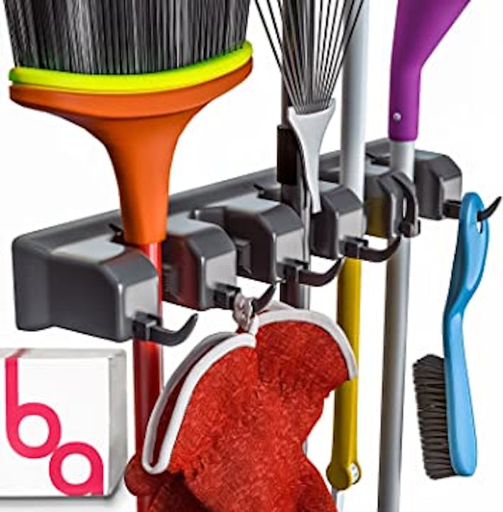 This broom, mop, and rake holder helps you improve the organization of your cleaning and garden tool...