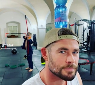Chris Hemsworth's son shoots a water bottle off his head with an bow and arrow.