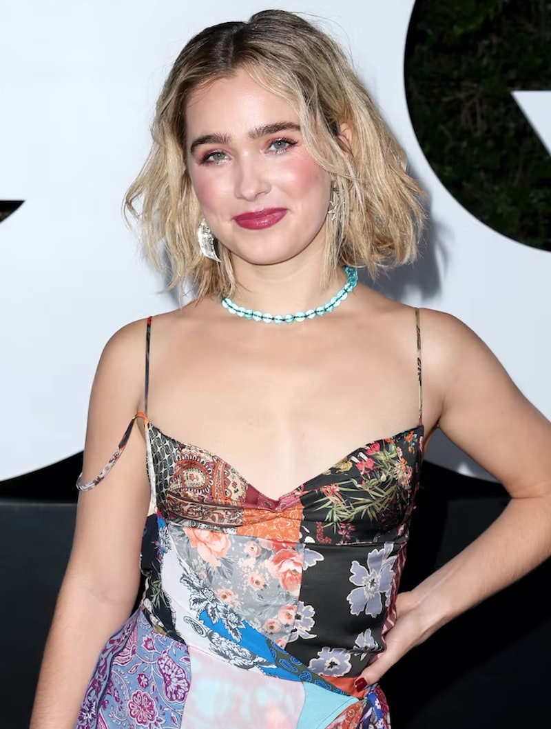 haley lu richardson wears a patchwork slip dress with a choker on the red carpet