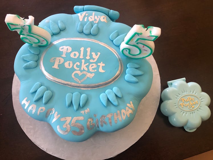 Picture of custom Poly Pocket-themed Birthday cake. 