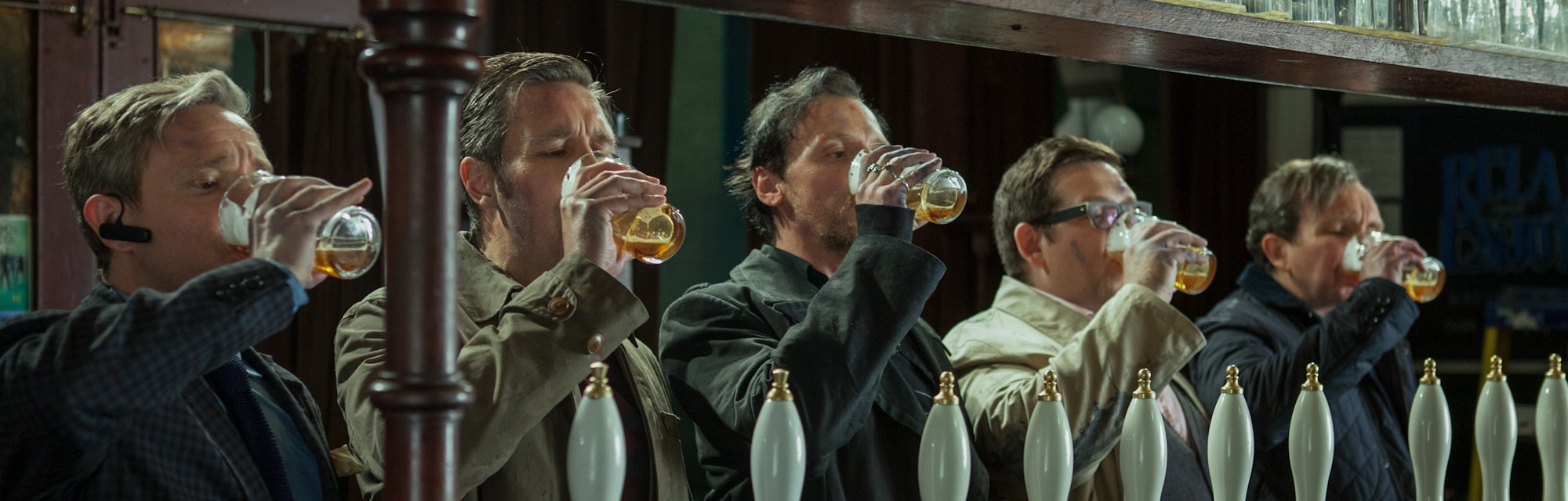 Martin Freeman, Paddy Considine, Simon Pegg, Nick Frost, and Eddie Marsan all drink from their beer ...
