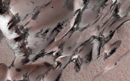 HiRISE captured these “megadunes,” also called barchans. Carbon dioxide frost and ice have formed ov...