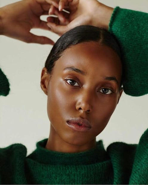 Revea skin scan model in green sweater