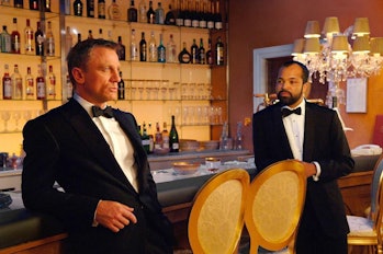 Daniel Craig and Jeffrey Wright lean against a bar in 2006's Casino Royale