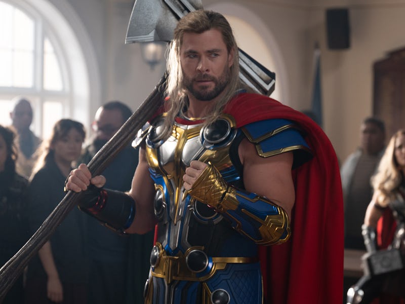 Chris Hemsworth rests Stormbreaker on his shoulder in Thor: Love and Thunder